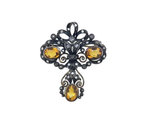 oval shaped, pierced scroll panel, with two rubover set oval faceted citrines, surrounded by rose cut diamonds, suspending a 