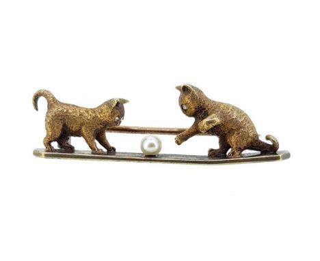 depicting two kittens playing with a ball of yarn, each kitten with diamond set eyes, and the yarn is a seed pearl, mounted t