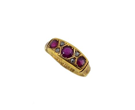 three round faceted rubies, from 3 to 3.7mm, further set with four rose cut diamonds, tapered and grooved shoulders, 'D' shap