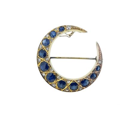 the closed crescent is set with eleven graduating oval faceted sapphires, length from 3.2 to 6mm, each spaced by two grain se