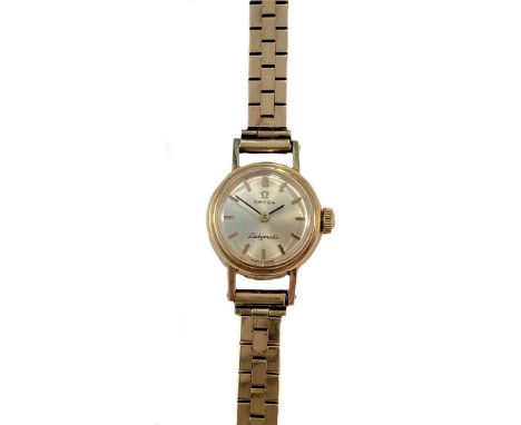 circa 1966, the signed circular silvered dial, 15mm diameter, with gold and black coloured batons and hands, signed 24 jewel 