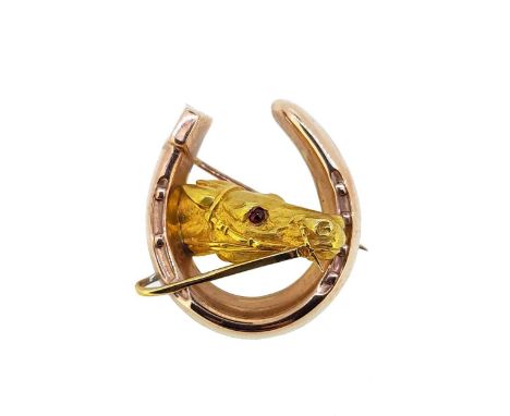 realistically modelled as a yellow metal bridled horse's head with a round cabochon ruby eye, within a rose coloured metal ho