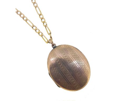 oval shaped locket with engine turned decoration, verso plain, jump ring bale, length including bale 6.5cm, width 3.6cm, unma