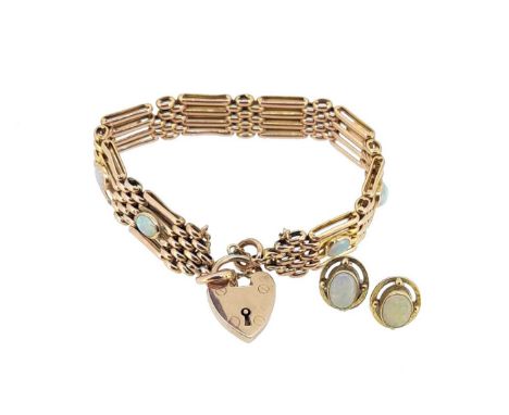 first, a gate bracelet set with eight 6 x 4mm oval cabochon opals, length 17cm, width 11mm, padlock fitting, unhallmarked, st