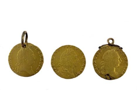 the first, a spade guinea dated 1793; the second a spade guinea dated 1790 with a drill hole and suspension ring; the third w
