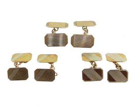 first, rectangular with cut corners and engine turned decoration, 18 x 10mm, chain connection, hallmarked Chester, 9ct gold; 
