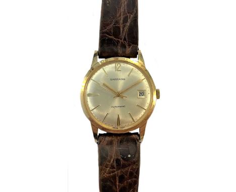 circa 1969, the signed circular silvered dial, 30mm diameter, with gold coloured batons and hands, centre sweep and date wind