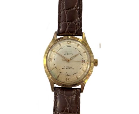 circa 1947, model 1242, the signed circular cream coloured dial with textured outer ring, 30mm diameter, gold coloured quatre