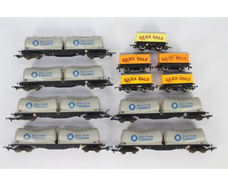Lima, Hornby - An unboxed rake of 11 OO gauge goods wagons. Lot includes Lima #305615 PCA Bogie Depressed Twin Tank Wagon 'Bl
