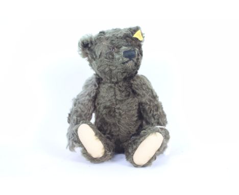 Steiff - An unboxed Steiff 'Classic' #000829 Dark Brown mohair jointed bear. The bear which measures approximately 25cms in h