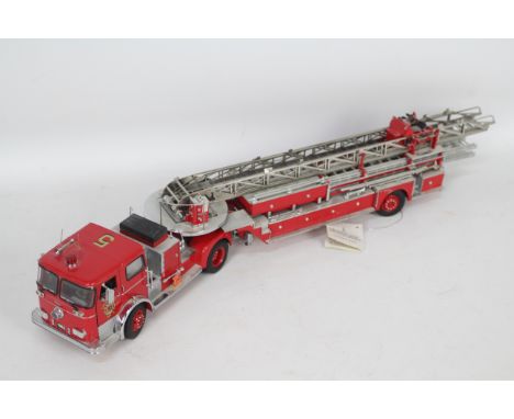 Franklin Mint - A 1965 Seagrave Aerial Ladder Fire Truck in 1:32 scale # B11WT77 . This detailed model is 52 cm in length and