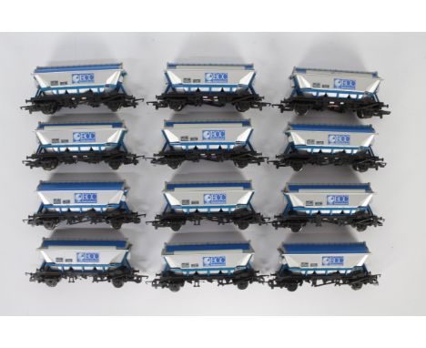 Hornby - A rake of 12 unboxed Hornby R052 CDA Closed Hopper Wagons in ECC International livery. The models appear to be in Ex