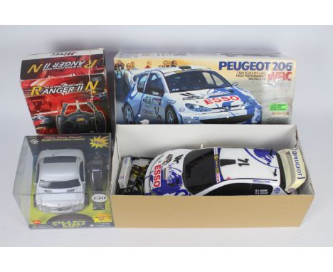 Tamiya - Kid-Riffic - 2 x boxed radio controlled cars, a Tamiya 1:10 scale Peugeot 206 WRC with a boxed Hi-Tec Ranger II cont