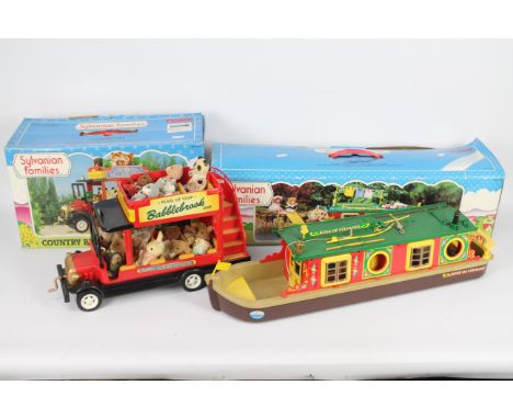 Epoch - Sylvanian Families - 2 x boxed models and 15 x figures, Country Bus # 3019 and Canal Boat # 3036. The models appear i