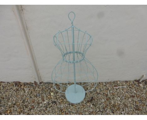 A metal female mannequin frame