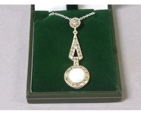 A silver art deco style pendant necklace with opal drop