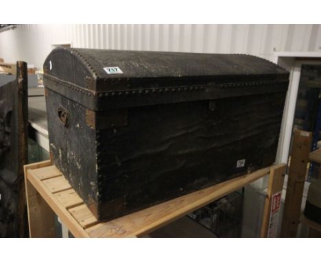 A vintage studded trunk, with paper label D Wallace Bristol 