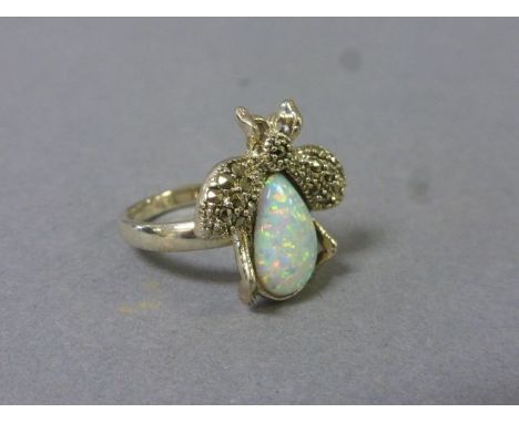 A silver, marcasite, and large central opal ring in the form of a bee