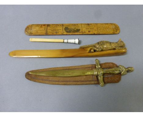 Three vintage letter opener/ page turners to include Mauchline Ware plus an enamel topped cigarette holder