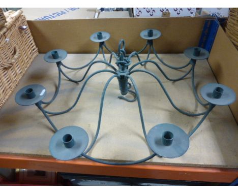 An eight branch metal chandelier