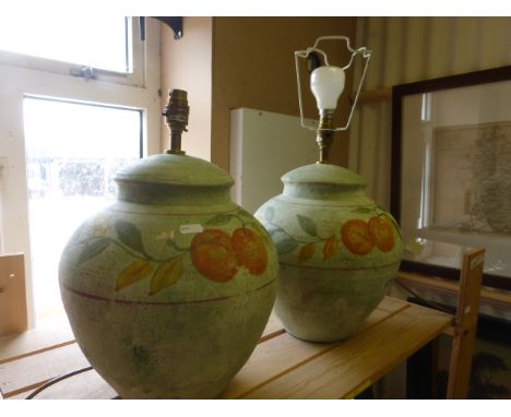 Two ceramic lamps each decorated with apples