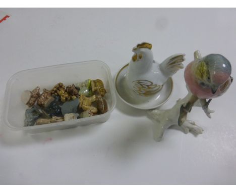 A small collection of Wade animals, along with a Royal Worcester chicken and a figure of a bird 