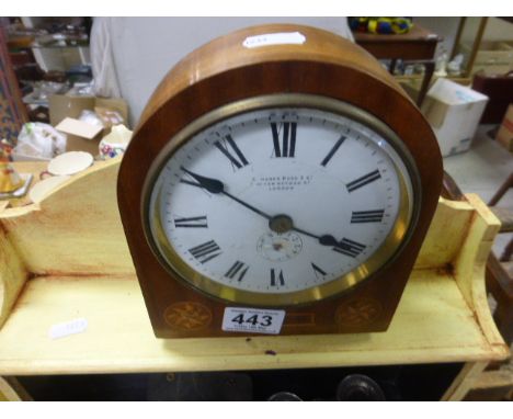 An early 20th century mahogany cased clock, the white enamel face with makers mark C Merer Kuss & Co, 56 New Oxford Street Lo