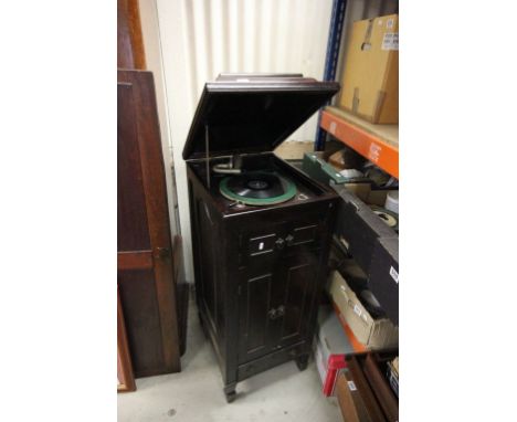A mahogany cased record player with fitted record section below and single drawer section