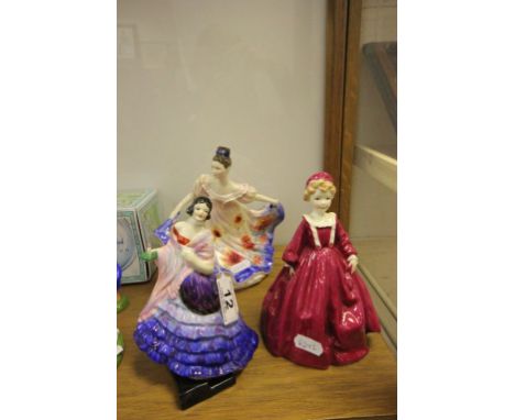 A Royal Worcester figure of a lady, along with another Royal Doulton figure of a lady and one other figure