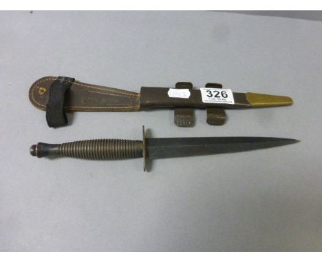 A commando knife with scabbard