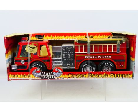 Nylint - A boxed diecast Metal Muscle #530 Classic Rescue Pumper - Classic Edition. Item appears in excellent condition and a