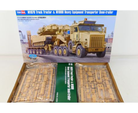 Hobby Boss - A boxed Hobby Boss 1:35 scale #85502 M1070 Truck Tractor & M1000 Heavy Equipment Transporter Semi-Trailer plasti