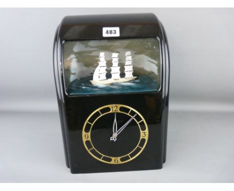 Vitascope black bakelite automaton clock with numerical dial and threemaster ship