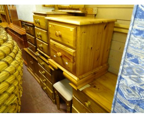 Parcel of pine bedroom furniture to include eight drawer dressing table and stool, two bedside chests, triple mirror and a do