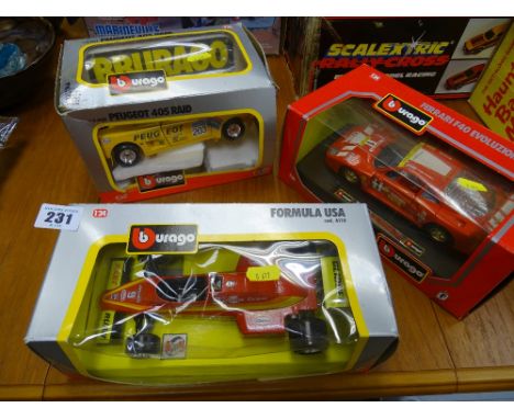 Three bubble packed Burago scale model vehicles