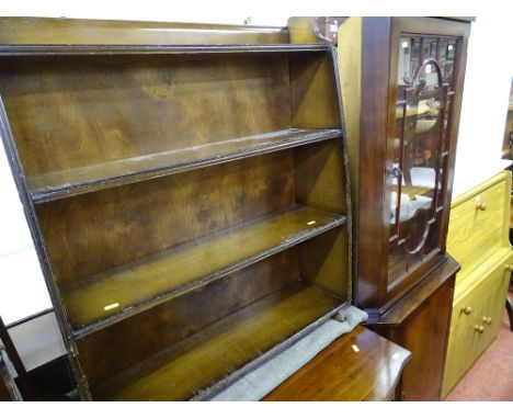 Polished wood corner cupboard with upper glazed door and a four shelf bookcase