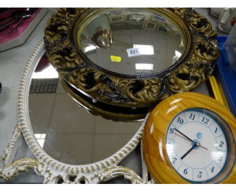Convex mirror, wall clock and another mirror