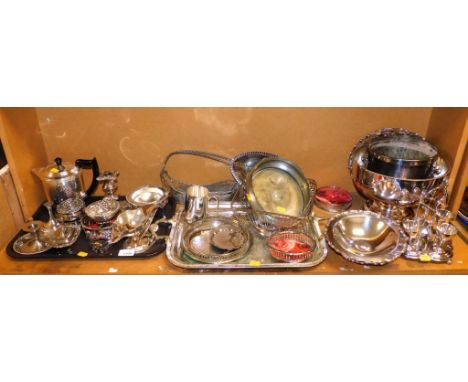 Silver plated wares, to include a coffee pot, small candlesticks, trays, goblets, etc.  (1 shelf)