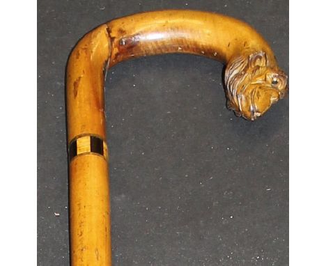 A 19th Century walking stick with parquetry ware banding, the handle terminating in a carved monkey head, 91 cm long CONDITIO