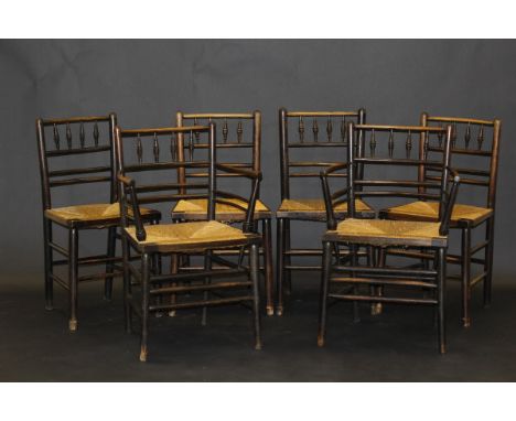 A set of six William Morris Sussex chairs after the refined design by Philip Webb, the rush seats on plain turned supports un