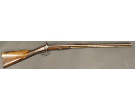 A 19th Century muzzle loading 12 bore shotgun, double barrel, side by side by Osbourn & Jackson, with engraved metalwork and 