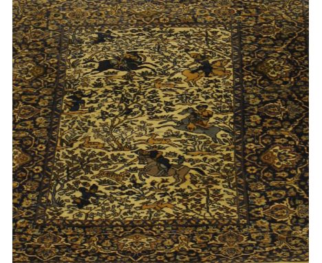 An Oriental hunting design rug, the rectangular cream centre field decorated with horses and riders and archers amongst flowe