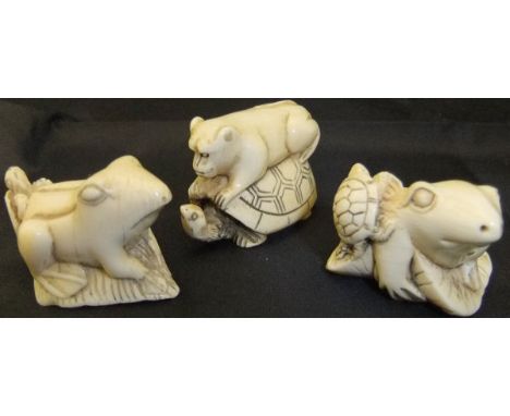 A Japanese carved ivory netsuke as a frog and turtle upon a lily pad, signed, 4.2cm long,  together with another similar, and