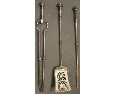 A set of three 19th Century iron fireside tools with rounded and stepped finial handle, the shovel with pierced grille decora