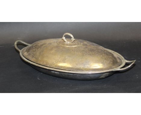 A George III silver tureen of plain oval form with two looped and reeded handles, the finial with acanthus decoration (maker'
