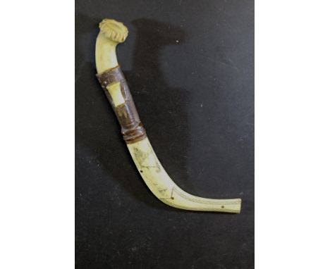 A 19th Century Japanese Meiji period carved antler and bone leather mounted knife, with skinning knife to handle, the scabbar
