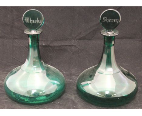 A 19th Century Bristol Green glass ship's type mallet shaped decanter with flattened stopped engraved "Whisky", and another t