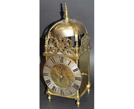 A brass cased lantern clock in the 17th Century style, the eight day twin fusée movement with silvered chapter ring and Roman
