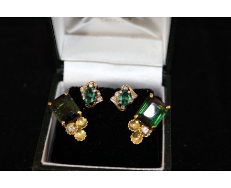 A pair of 18ct gold tourmaline and diamond set ear clips and small pair of emerald and diamond ear clips CONDITION REPORTS To