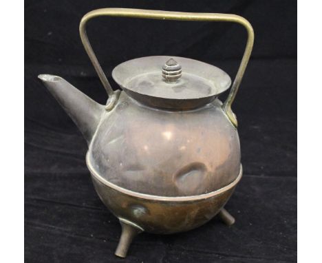 A copper and brass kettle by Christopher Dresser for Benham & Froud, with brass handle and ovoid copper body, the lid with tu